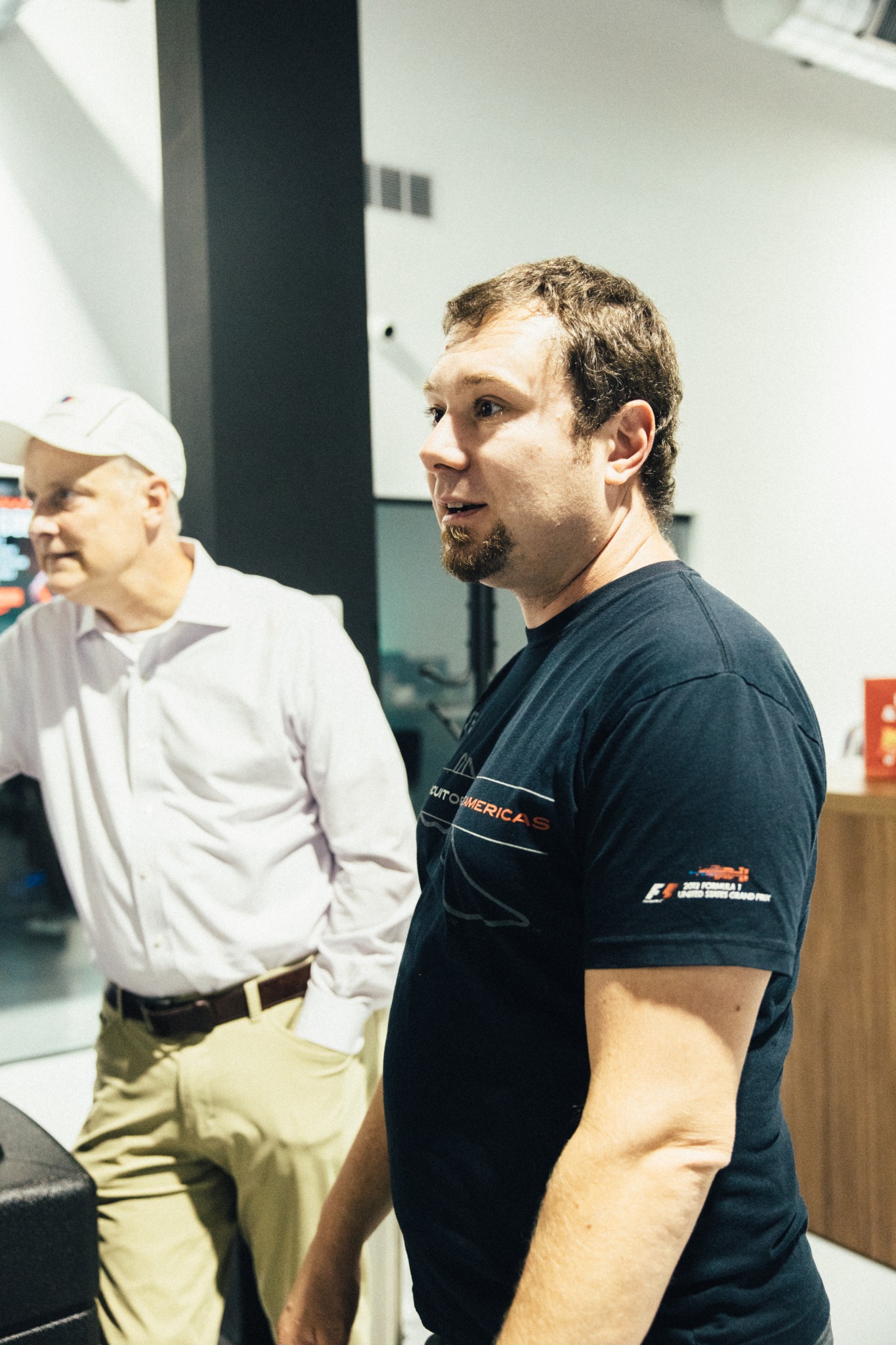 Members gathered inside SIM1 Racing before the evening's simulator competition.